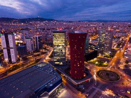 Aerial view of illuminated Plaza de Europa with modern conference center Fira Barcelona Gran Viaの写真素材