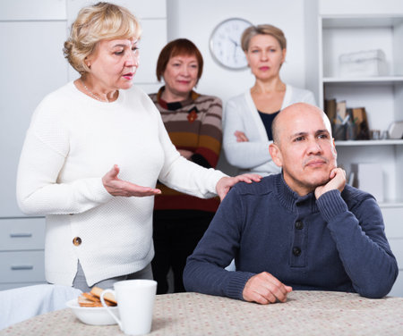 Mature woman is apologizing to friend for quarrel at home.
