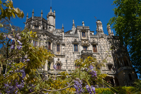 SINTRA, PORTUGAL - APRIL 21, 2019: View of main facade of impressive palace in Quinta da Regaleiraのeditorial素材
