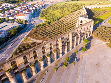 View of Amoreira Aqueduct with four registers of  waterway at extreme height near Portuguese town of...