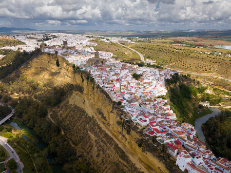 Aerial view of ancient city of Arcos de la Frontera located on edge of cliff on bank of Guadalete river, Andalusia, Spainの写真素材