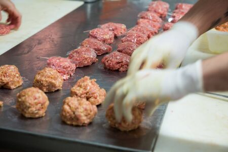 Process cooking meat production for sale in butcherâs shopの写真素材