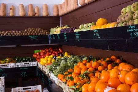 Showcase with fruits and vegetables in greengroceryの写真素材