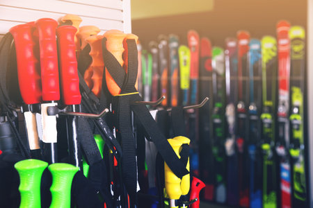 Ski poles for sale in modern store of sports equipment