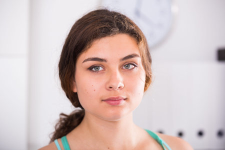 Portrait of trainee woman which is working in office.