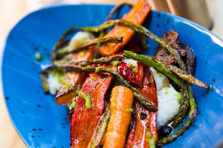 Appetizing dish - tender fillets of cod fish with grilled vegetablesの写真素材