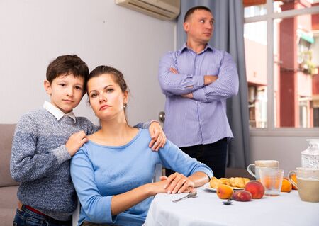 Depressed parents with teen son after conflict at homeの写真素材