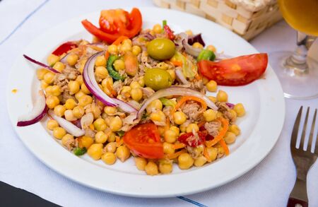 Spanish cuisine - salad with garbanzos and olivesの写真素材