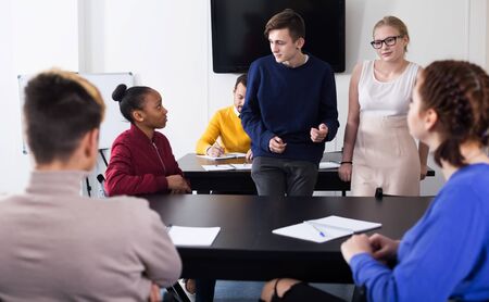 Fellow students talking merrily at break during school dayの写真素材