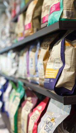 BARCELONA, SPAIN - MAY 07, 2018: Assortment of pet feed for sale on shelves in shopのeditorial素材