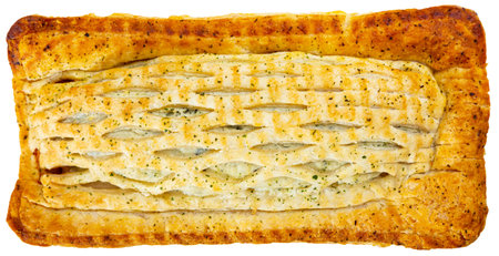 Top view of delicious puff pastry pie with fish filling from salmon served. Isolated over white...