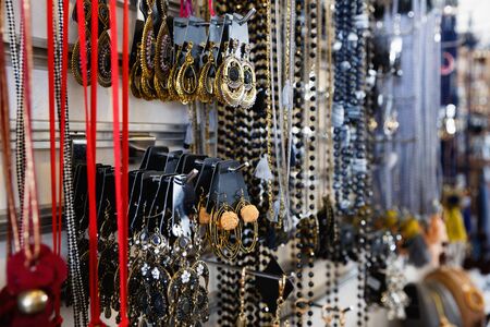 Picture of colored  fashionable bijouterie hanging on the stand in the storeの写真素材