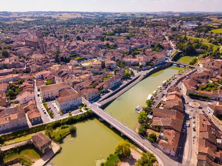 Panoramic aerial view of Condom city on Baise river on sunny summer day, Gers, Franceの写真素材