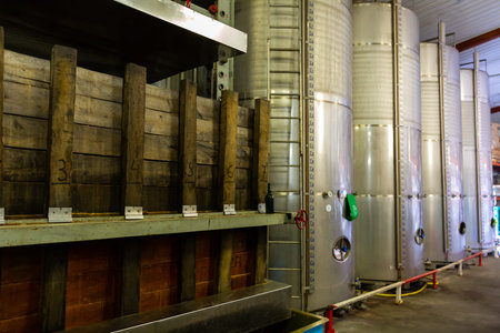 Room with apple press and fermentation containers in traditional Asturian Sidreriaの写真素材