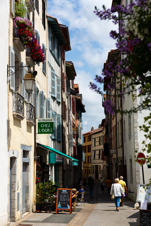 BAYONNE, FRANCE - JULY 17, 2019: Picturesque summer cityscape overlooking vibrant pedestrian streetのeditorial素材