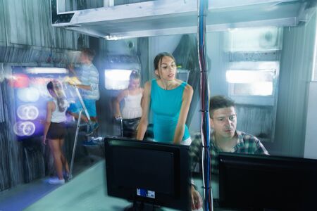 Happy cheerful positive  family of five is using PC in time having fun together in lost labroom.の写真素材