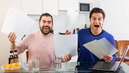 Men discuss and sign apartment sale contract agreement at home
