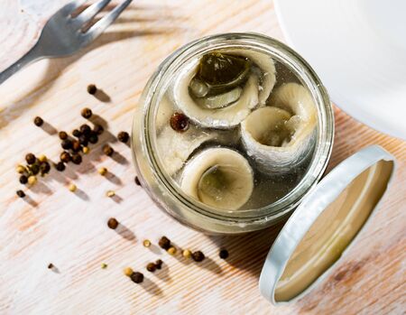 Glass jar with pickled herringの写真素材