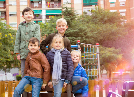 Group portrait of cheerful children having fun together outdoors