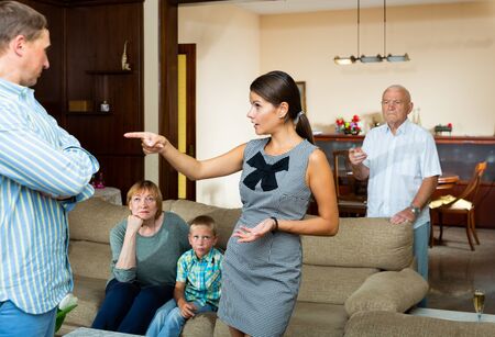 Quarrel between husband and wife in a large familyの写真素材