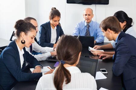 Working  meeting positive staff of team on business project in officeの写真素材