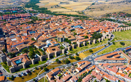 Aerial cityscape of medieval Spanish city Avila with stone defense wall