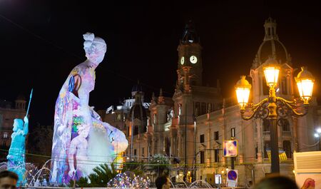 VALENCIA, SPAIN - MARCH 18, 2019: Giant colorful artistic monument (falla) created of comic figures (ninots) for parade on city streets during traditional Falles celebrationのeditorial素材