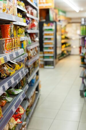 BARCELONA, SPAIN - FEBRUARY 07, 2019: Colored shelves of grocery store with various productsのeditorial素材