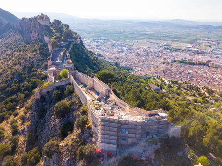 Aerial view of medieval fortress Xativa Castle at sunny day, Valencia, Spainのeditorial素材
