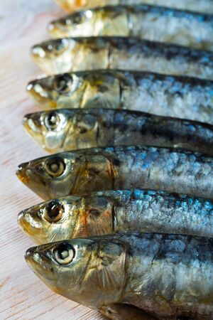 Seafood delicacy, whole marinated sardines on wooden backgroundの写真素材