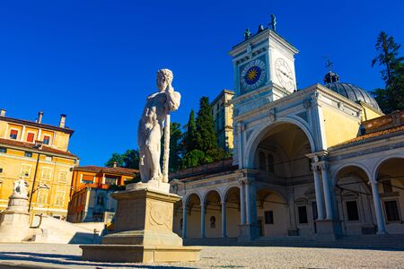 View of church of San Giovanni and clock tower (Torre dell Orologio) on central city square of Piazza liberta, Udine, Italyの写真素材