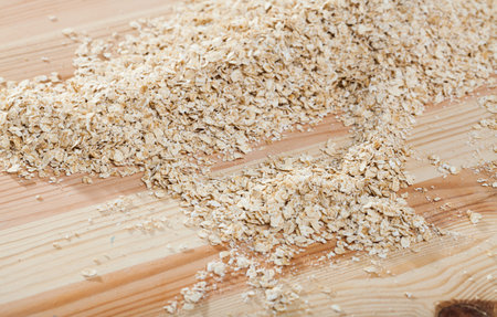 Organic dry oat-flakes natural background