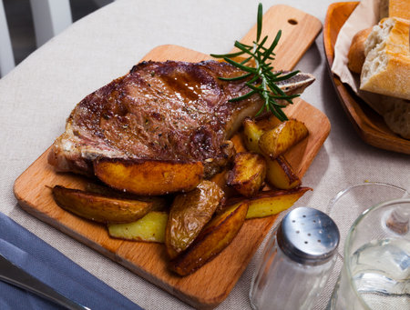 Appetizing beef steak with potatoes and rosemary