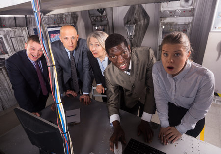 Portrait of thoughtful men and women spending time in escape room