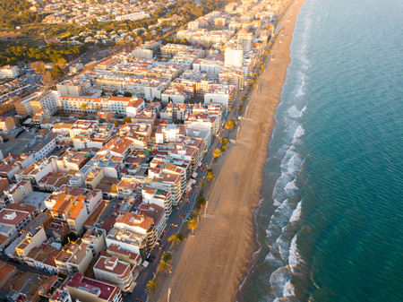 Panoramic aerial view of Spanish coastal town of Calafell in sunny day, Cataloniaのeditorial素材