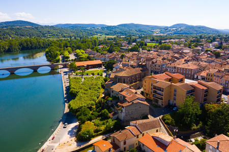 Panoramic aerial view of Cazeres city on Garonne river on sunny summer day, Haute-Garonne, Franceのeditorial素材