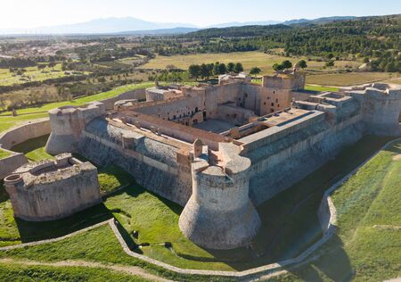 Aerial view of countryside of Northern Catalonia with massive ancient Fort de Salses, Franceの写真素材