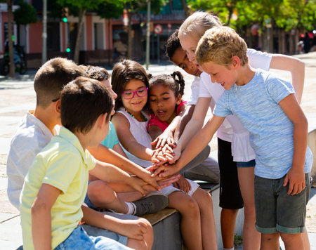 Happy kids playing on summer city street