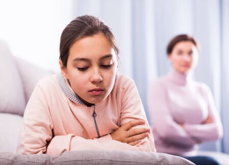 Mother and teenage daughter take offense at each other because of quarrelの写真素材