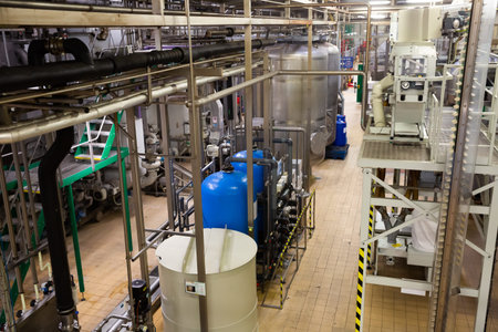 PILSEN, CZECH REPUBLIC - OCTOBER 10, 2019: Inside view of bottling department of Pilsner Urquell brewery with beer bottles on conveyor beltのeditorial素材