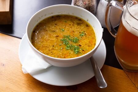 Traditional thick Czech soup (Polevka) with fried cabbage and minced beef meatの写真素材