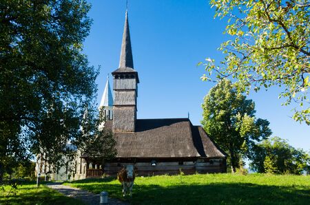 Old and new edifices of church in Remetea Chioarului village, Romaniaの写真素材