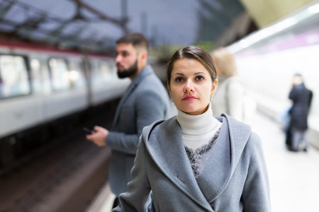 Attractive woman walks on the subway station