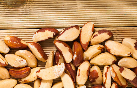 Tasty brazil nuts closeup on wooden surface
