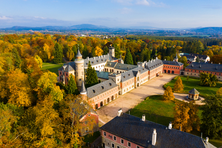 Scenic aerial view of historical neo-gothic Sychrov castle with colorful fall park, Czech Republicのeditorial素材