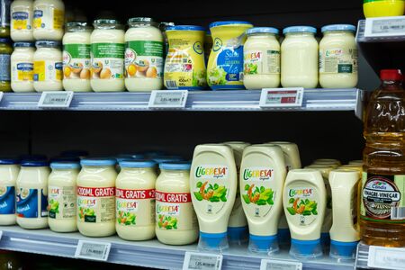 BARCELONA, SPAIN - NOVEMBER 07, 2019: Variety of popular sauces on display in grocery shopのeditorial素材
