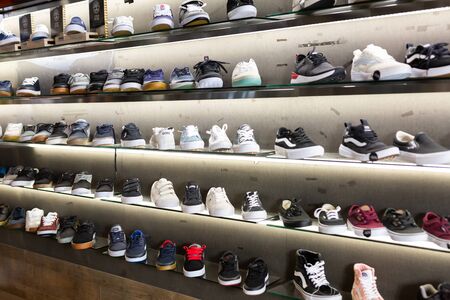 Barcelona, Spain - October 07, 2019: Shelves with sport shoes in the shoes shopのeditorial素材