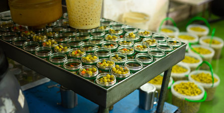 Olives and other ingredients in glass jars for canning