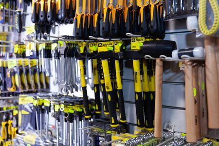 BARCELONA, SPAIN - OCTOBER 22, 2019: Hammers, spanners, wrenches, screwdrivers and other tools on stand in storeのeditorial素材