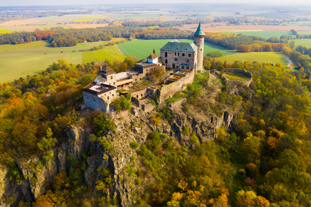 Picturesque autumn landscape with imposing historic Kuneticka Hora Castle on hilltop above Czech village of Raby, Pardubice Regionのeditorial素材